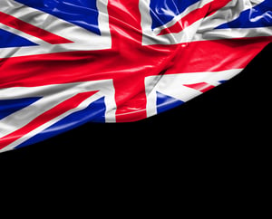 UK waving flag on black background