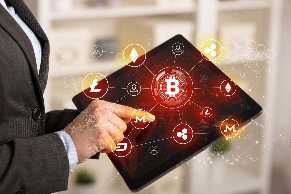 Business woman using tablet with cryptocurrency bitcoin link network concept